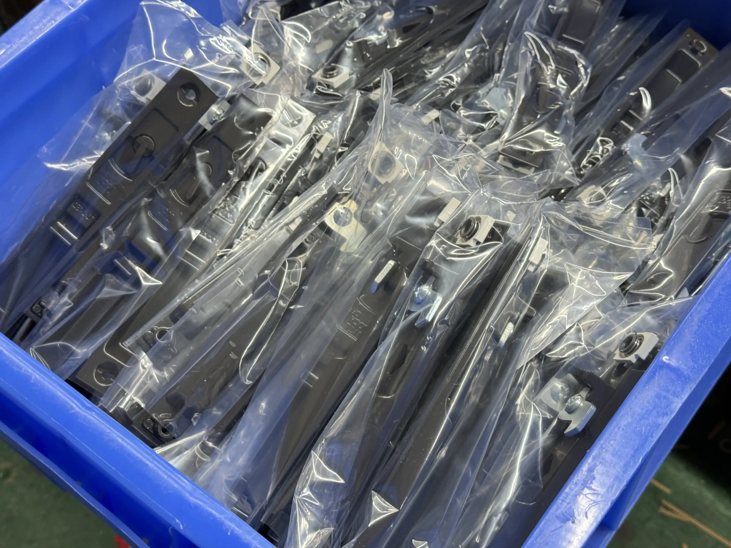 Semi-finished metal hardware parts packed for factory assembly