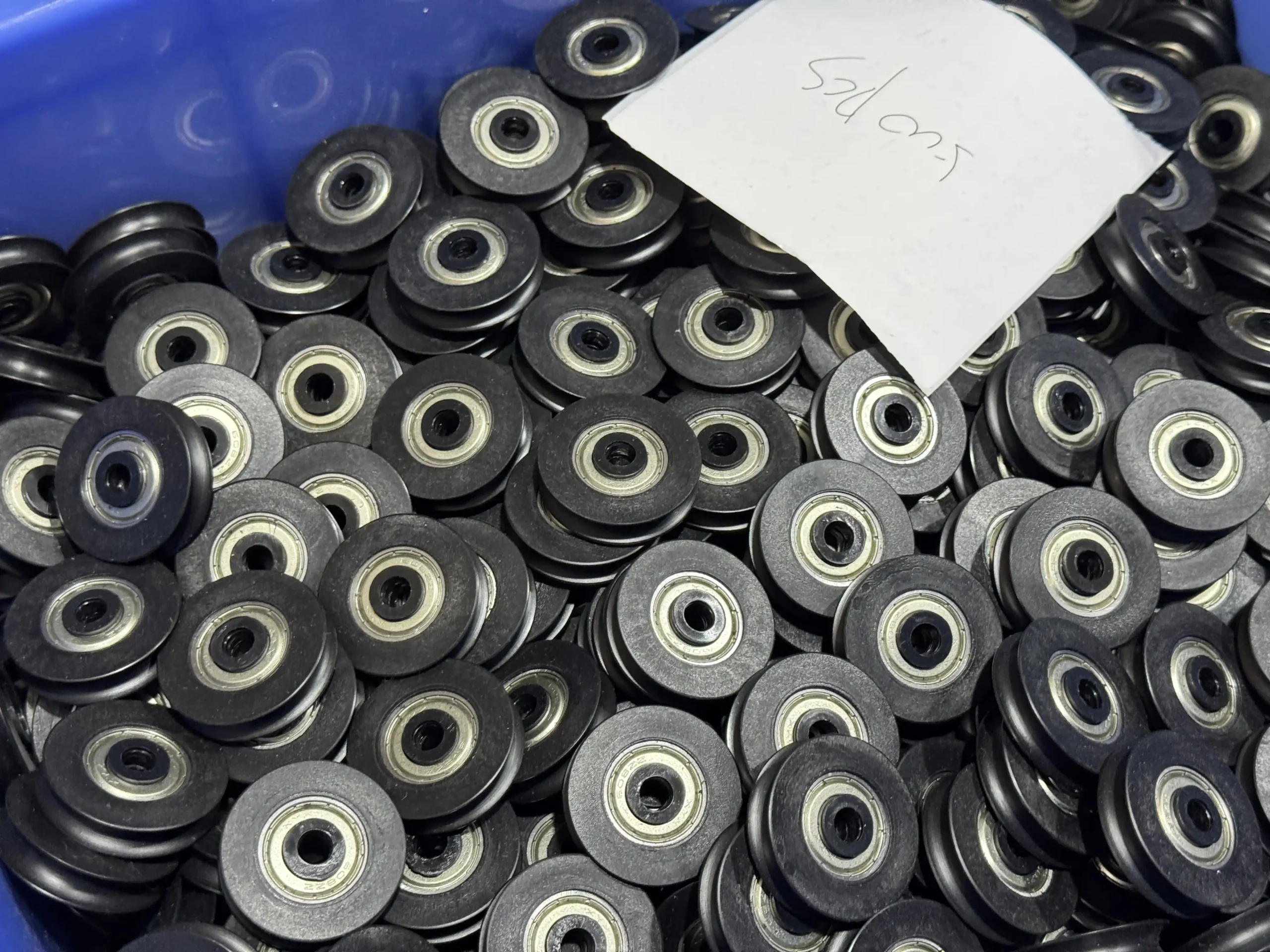 Sliding door roller components in factory workshop for OEM bulk production