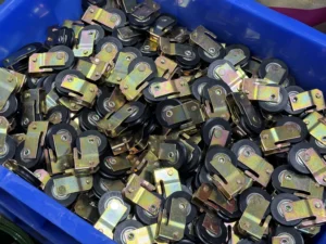 Stamped metal lock components for sliding door hardware production