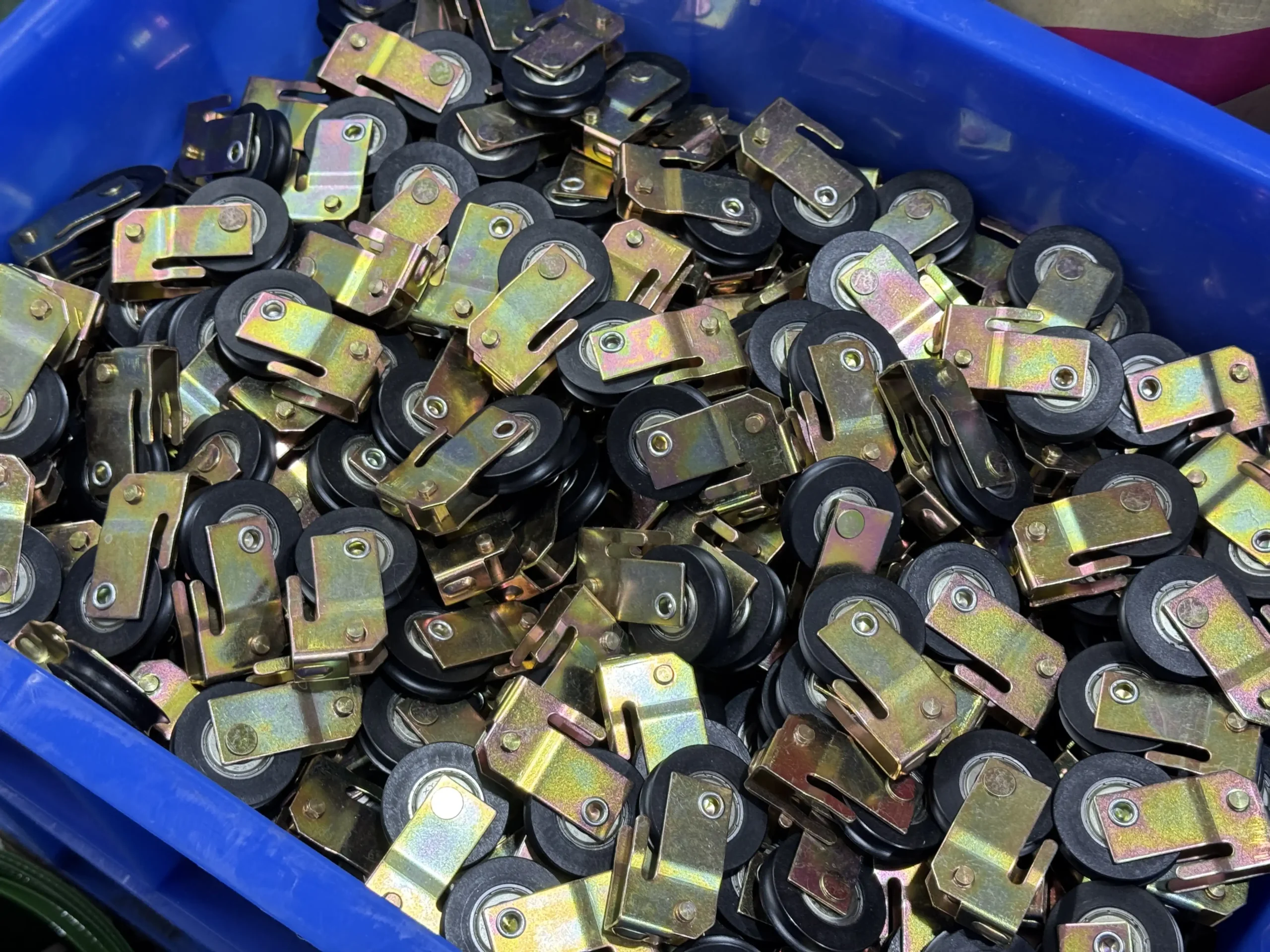 Stamped metal lock components for sliding door hardware production