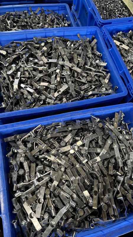 Bulk stamped steel housing brackets for heavy-duty sliding door roller assembly