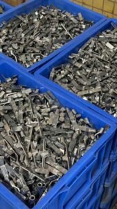 Wholesale door hardware lock internal accessories stored in factory blue storage bins for direct OEM export.