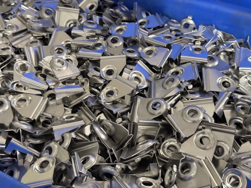 Bulk stock hardware inventory of sliding window rollers packaged for export dispatch